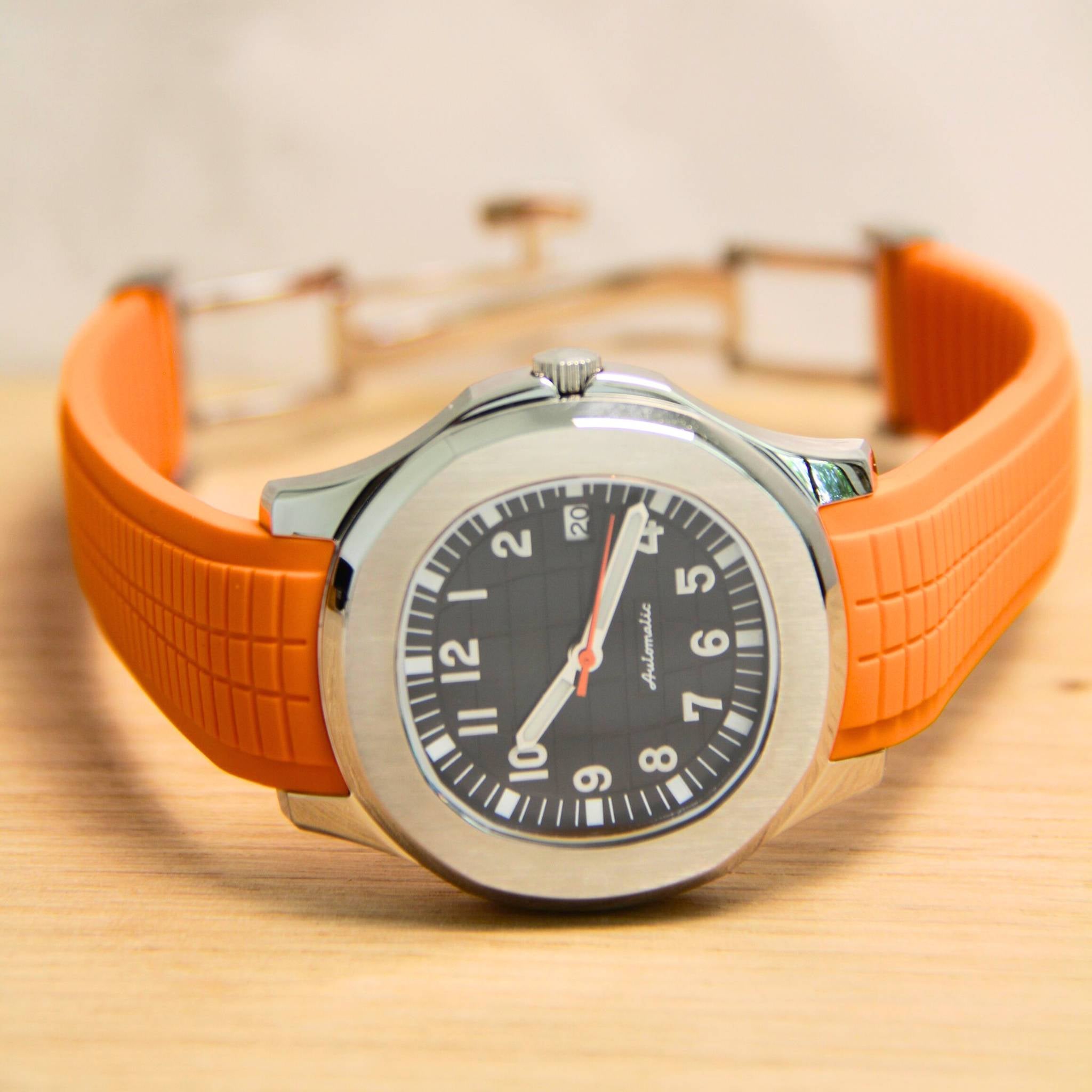 Montre SEIKMOD Aquanaut Orange Noir automatique NH35 photographiée à plat.